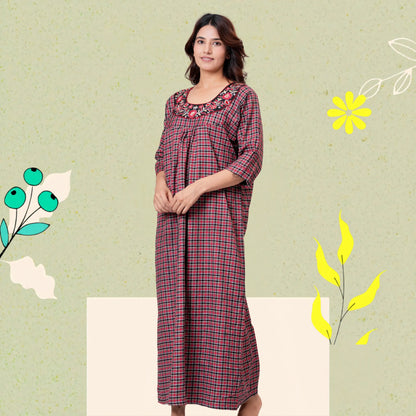 Woman wearing HARGUN brown cotswool winter nightgown with full sleeves.
