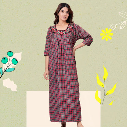 Woman wearing HARGUN brown cotswool winter nightgown with full sleeves.